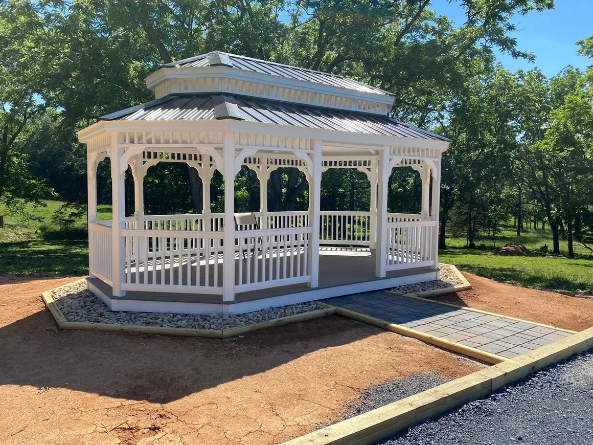 white gazebo with sidewalk